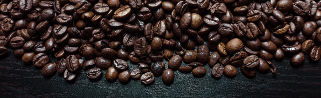 Coffee beans on black wood